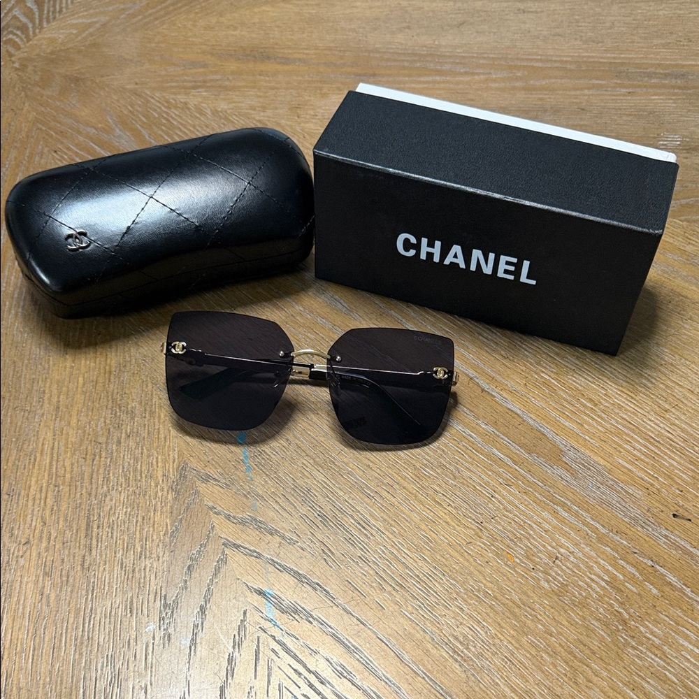 CHANEL Black Rimless Square Sunglasses with Gold Accents - Picture 2 of 9